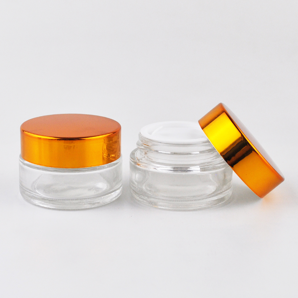 High quality round bottle clear glass jar with gold aluminum lid cosmetics bottle container