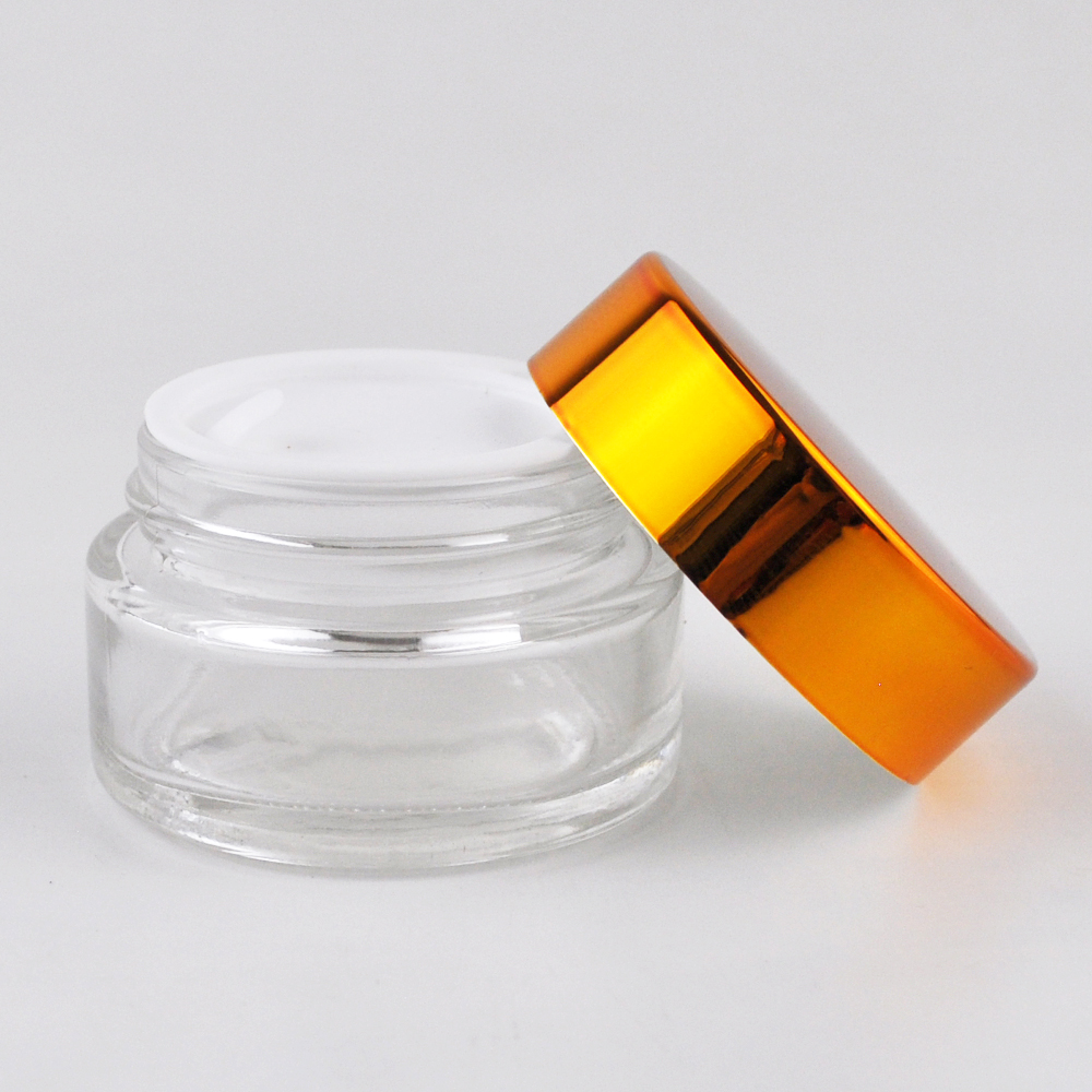 High quality round bottle clear glass jar with gold aluminum lid cosmetics bottle container