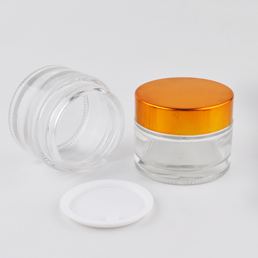 High quality round bottle clear glass jar with gold aluminum lid cosmetics bottle container
