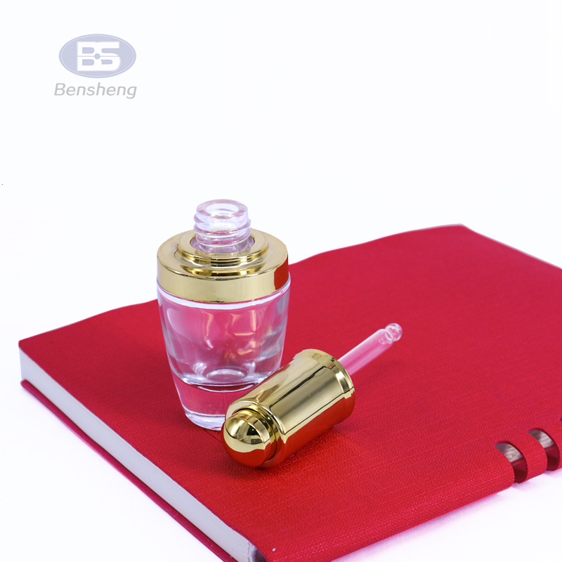 High quality round clear 30ml essential oil bottle gold silver glass press pump dropper bottle serum bottles