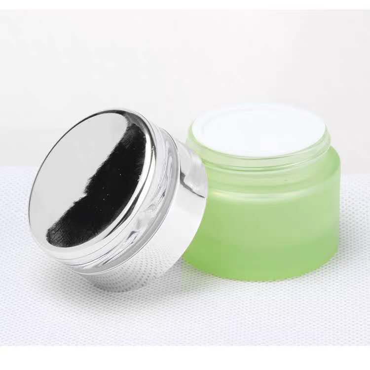 High quality small cosmetic cream round green 30ml 1 oz glass jar with black golden silver aluminum screw top lid