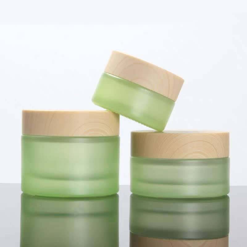 High quality small cosmetic cream round green 30ml 1 oz glass jar with black golden silver aluminum screw top lid