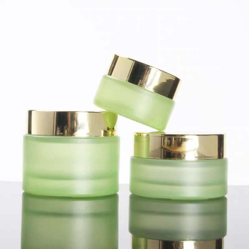 High quality small cosmetic cream round green 30ml 1 oz glass jar with black golden silver aluminum screw top lid