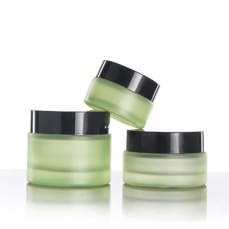 High quality small cosmetic cream round green 30ml 1 oz glass jar with black golden silver aluminum screw top lid