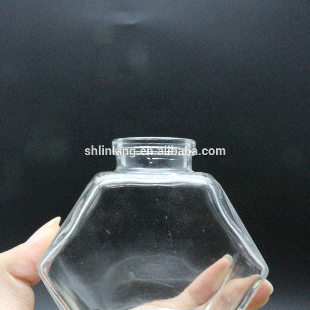 Honey glass jar with wooden lid and spoon