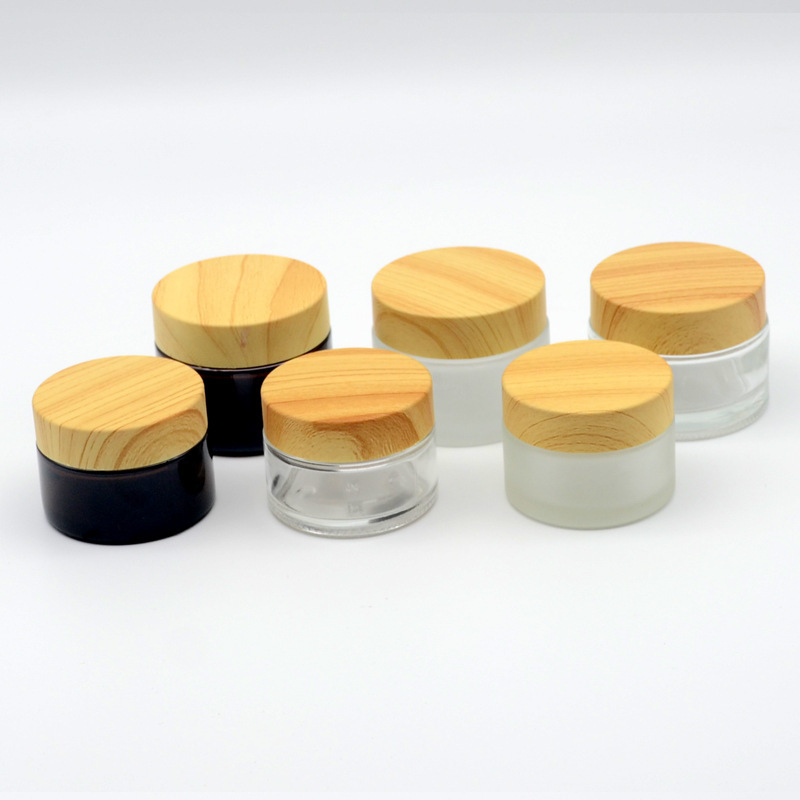 Hot Sale Eco Friendly 30g 50g 100g Empty  Matt Frosted Wooden Bamboo Lid Cap Glass Cosmetic Jars