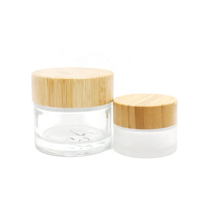Hot Sale Eco Friendly Custom Logo 50g 100g Empty Matt Frosted Wooden Bamboo Lid Glass Cosmetic Jars