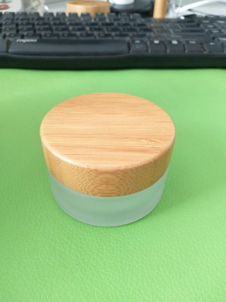 Hot Sale Eco Friendly Custom Logo 50g 100g Empty White Matt Frosted Wooden Bamboo Lid Cap Glass Cosmetic Jars