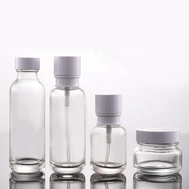 Hot Sale Round Shoulder Clear Cosmetic Glass Lotion Bottle 50g 50ml 110ml 130ml with Pump