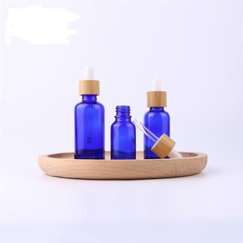 Hot Sales Blue Essential Perfume Bottle Bamboo Hair Essential Oil Dropper Frosted Glass Bottles