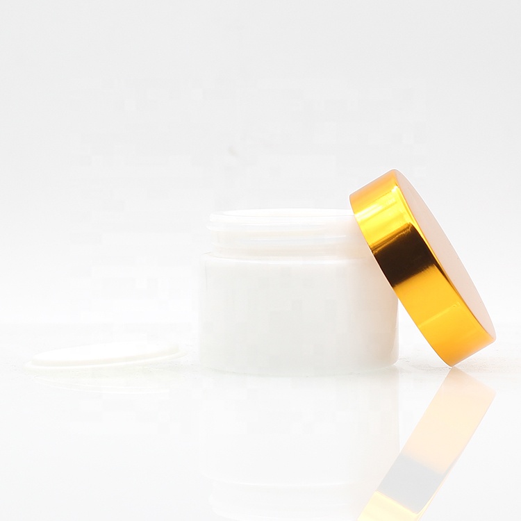 Hot Selling 50g 100g white cosmetic ceramic glass cream jar with plastic lid glass jars and lids aluminum gold cap face care