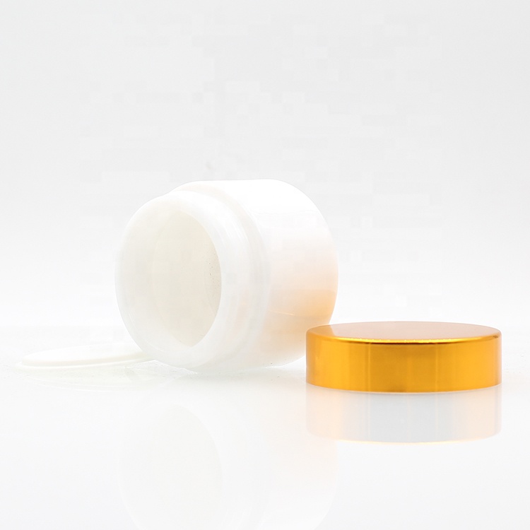 Hot Selling 50g 100g white cosmetic ceramic glass cream jar with plastic lid glass jars and lids aluminum gold cap face care