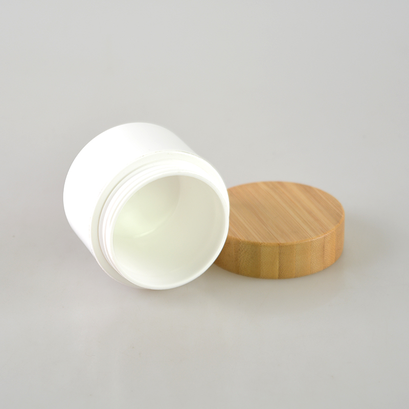 Hot cake cosmetic packaging container plastic cream jars with bamboo lid