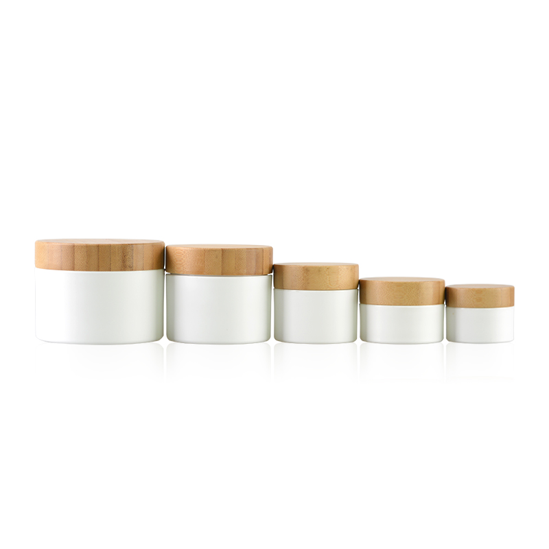 Hot cake cosmetic plastic cream jars with bamboo lid for skincare packaging