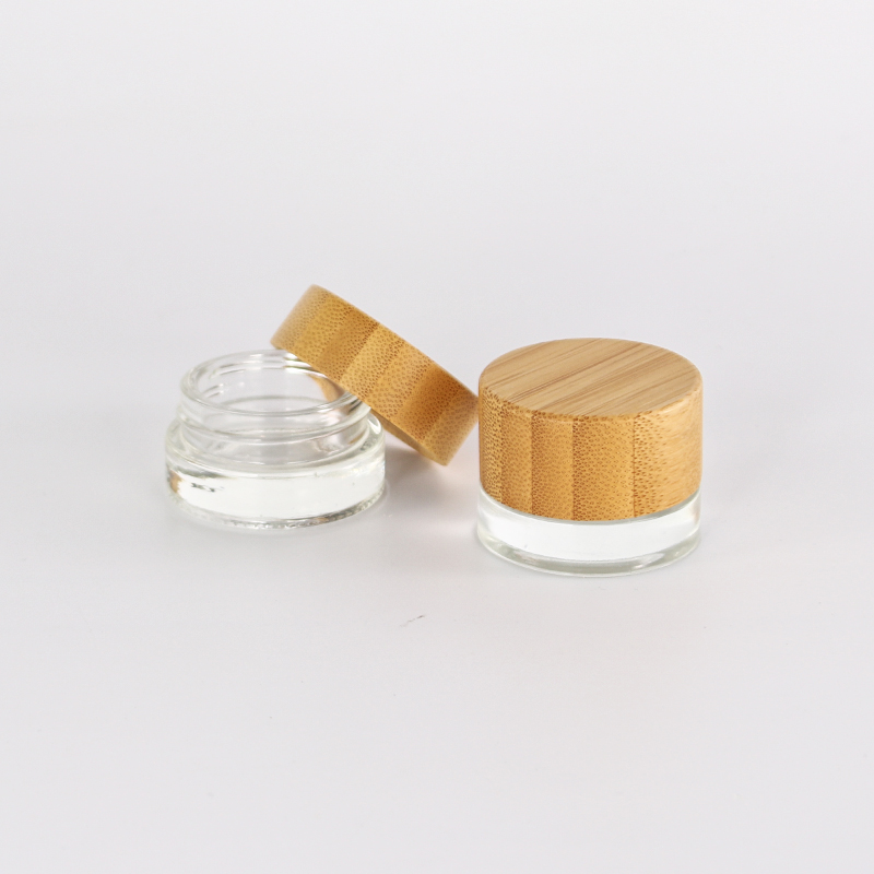 Hot cosmetic plastic cylinder container face eye cream acrylic jars pot with bamboo wooden lid