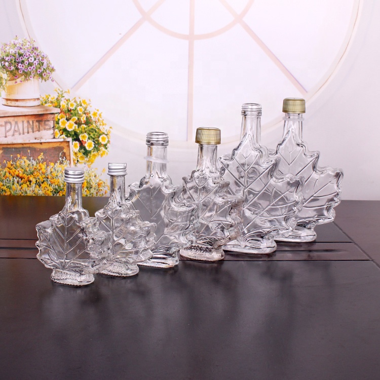 Hot sale 100ml maple leaf shape glass wine bottle with screw top lid