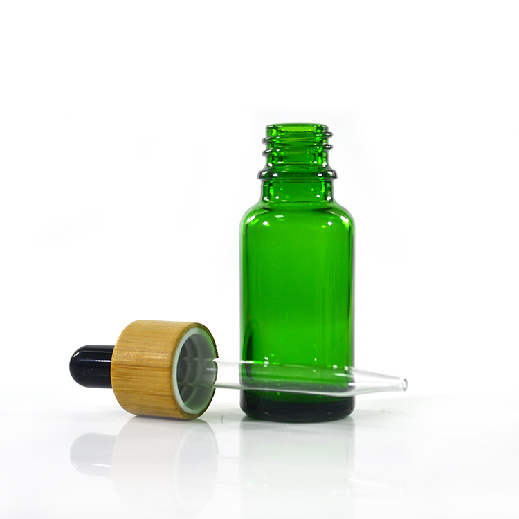 Hot sale 10ml 15ml 30ml 50ml 100ml amber clear green glass dropper bottle with bamboo cap and glass pipette