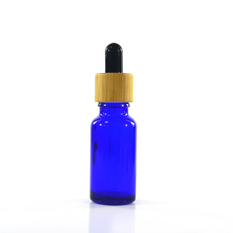 Hot sale 10ml 15ml 30ml 50ml 100ml amber clear green glass dropper bottle with bamboo cap and glass pipette