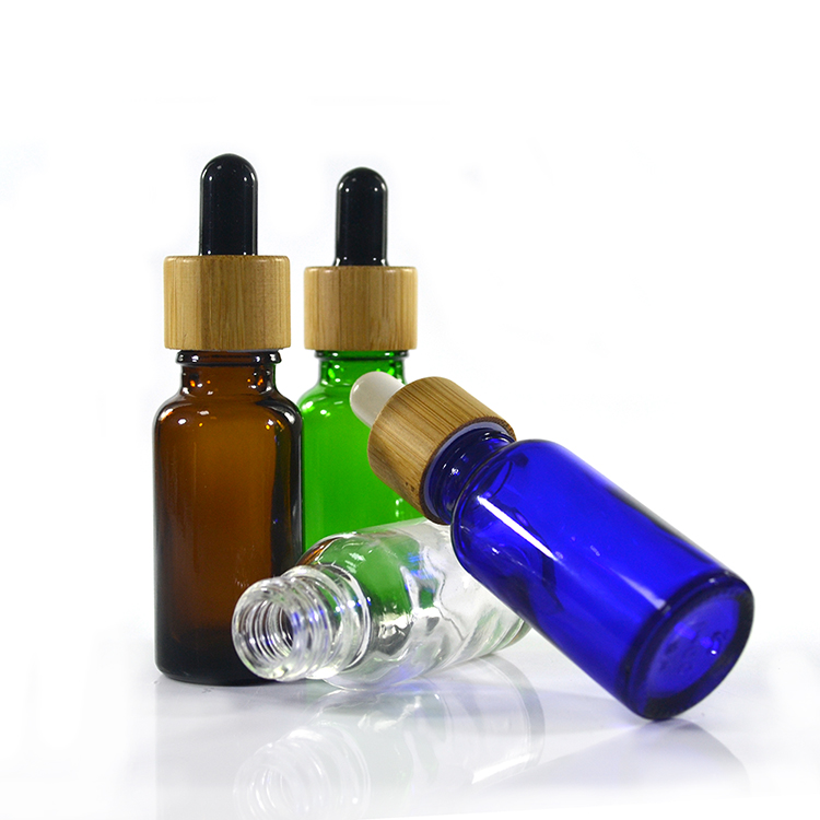 Hot sale 10ml 15ml 30ml 50ml 100ml amber clear green glass dropper bottle with bamboo cap and glass pipette