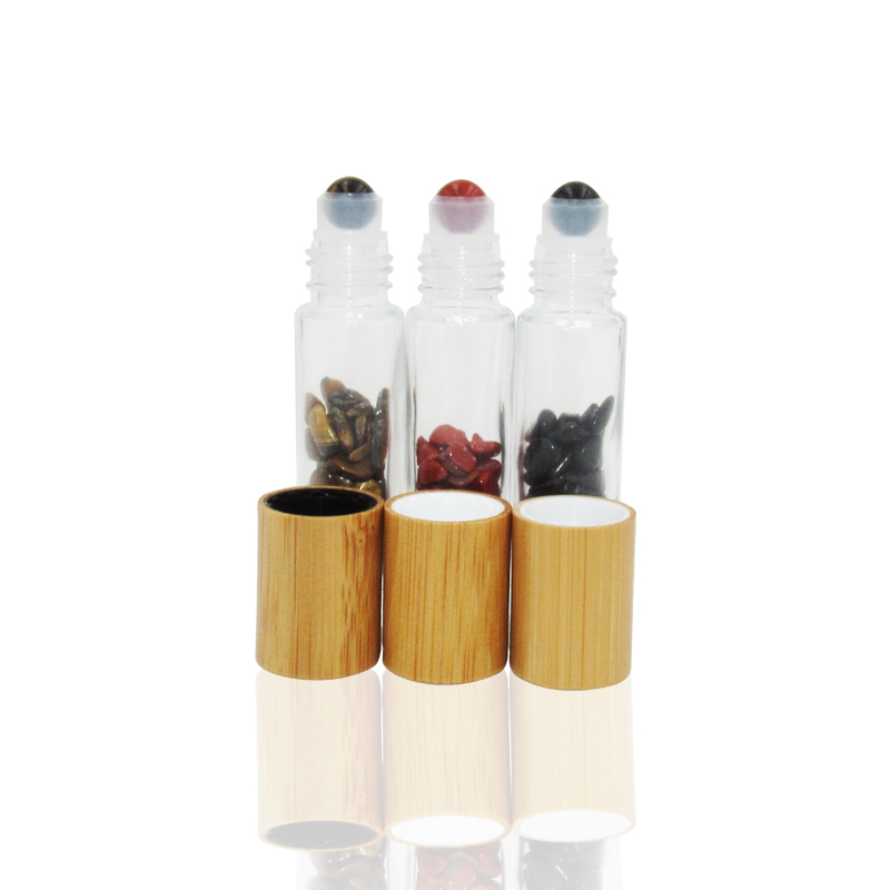 Hot sale 10ml clear transparent glass essential oils perfume gemstones roller ball bottles with bamboo lid