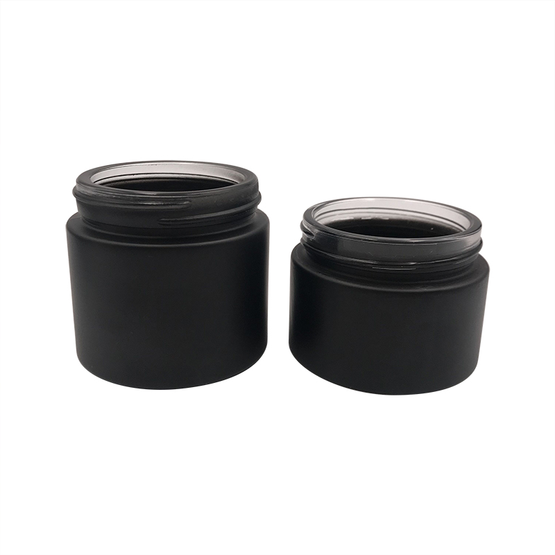 Hot sale 15ml 30ml 50ml 100ml 1oz 2oz frosted clear black glass cosmetic cream jar with black aluminum lid