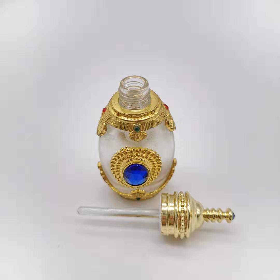 Hot sale 15ml Unique Arabic Style Metal Essential Oil Attar Perfume Glass Bottles with Glass Stick