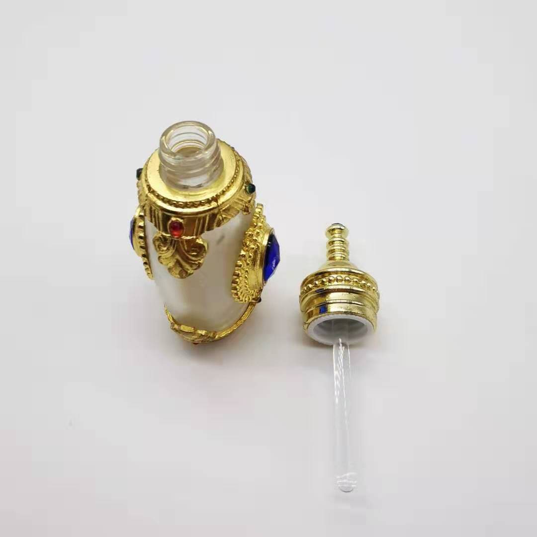 Hot sale 15ml Unique Arabic Style Metal Essential Oil Attar Perfume Glass Bottles with Glass Stick