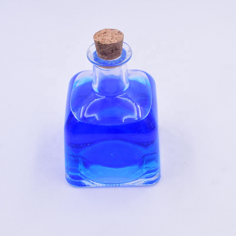 Hot sale   200 ml clear ger shape perfume aromatherapy glass bottle with cork