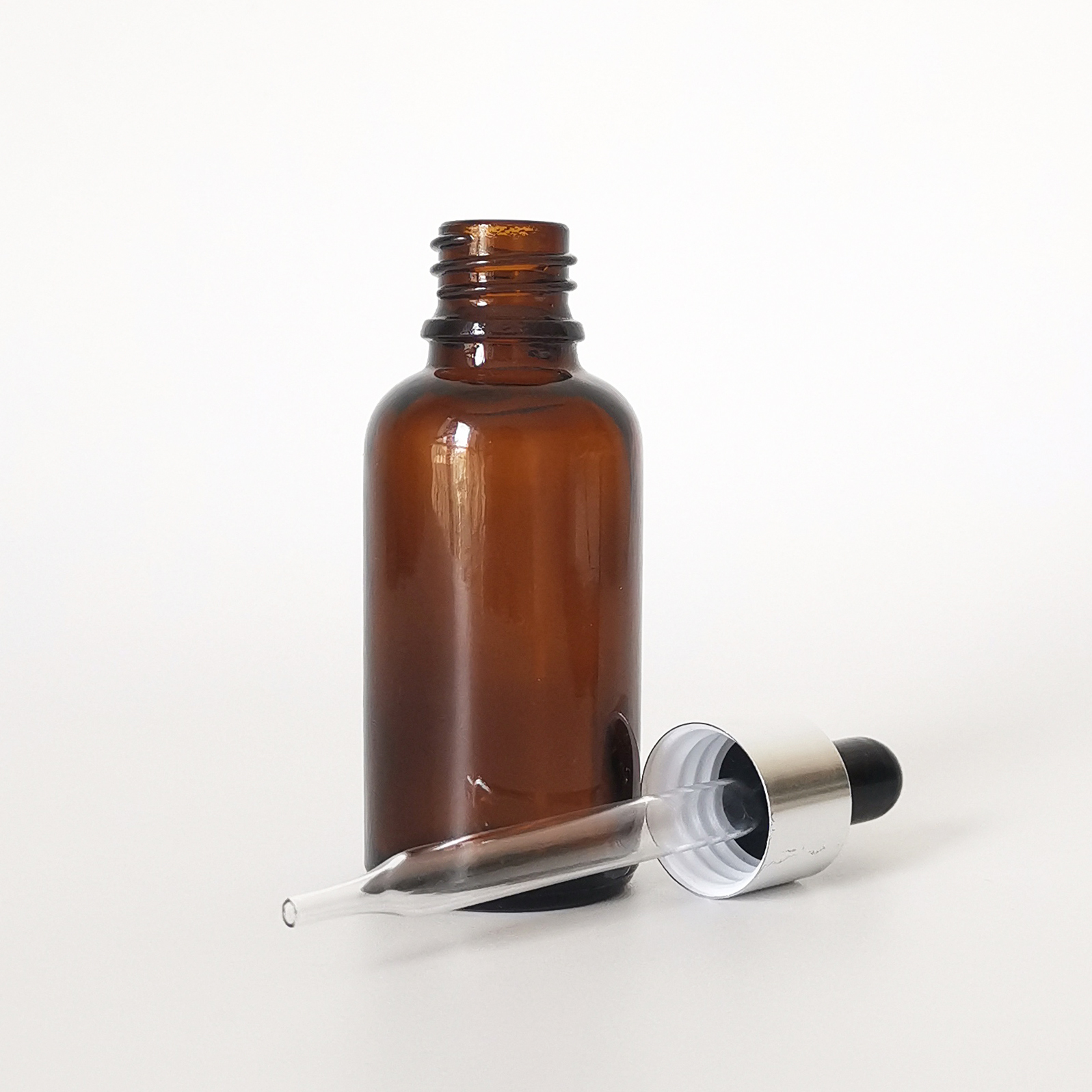 Hot sale 30ml clear amber round press pipette dropper cosmetic glass essential oil dropper bottle with aluminum cap