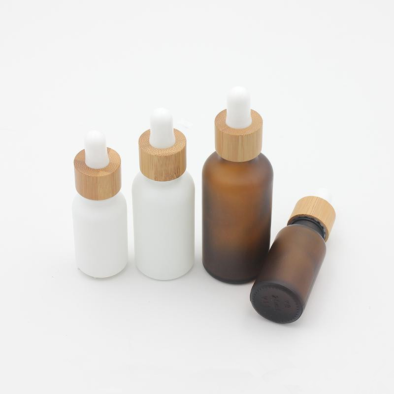 Hot sale 30ml matte white black frosted glass cosmetic dropper bottle with golden or black dropper for essential oil