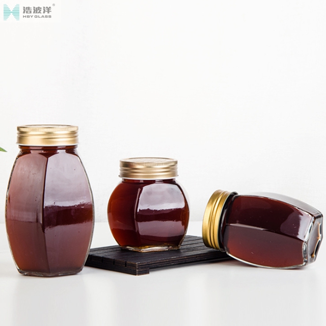 Hot sale 380ml 730ml transparent hexgonal honey glass jar with screw lid