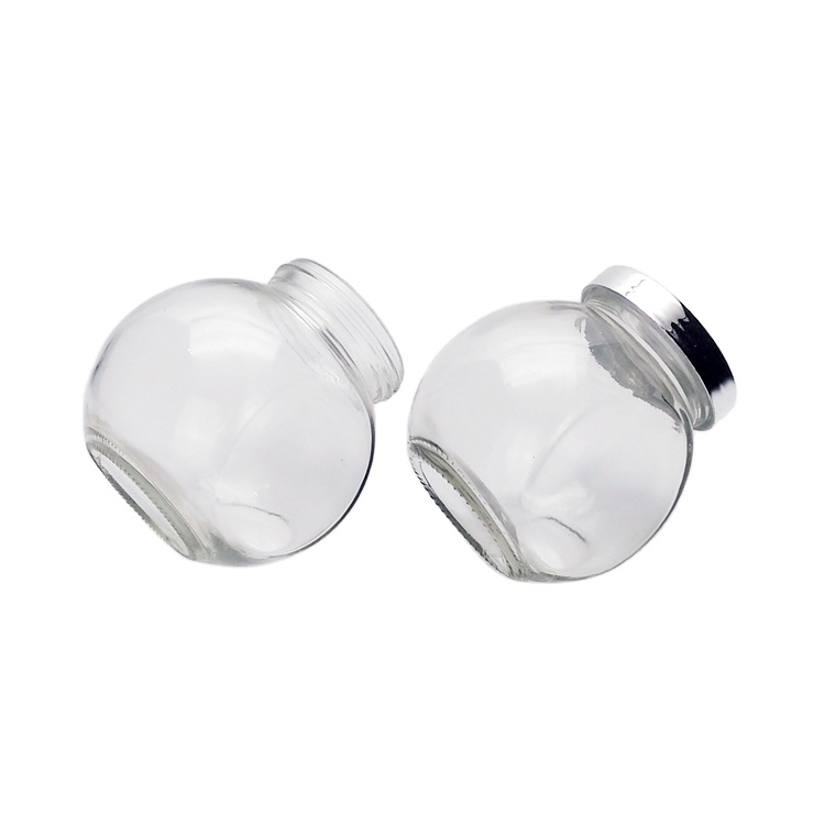 Hot sale 380ml flat drum shaped clear glass storage jar for candy nut honey jam