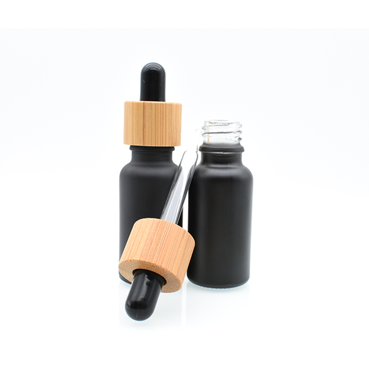 Hot sale 5ml 10ml 15ml 20ml 30ml 50ml 100ml bamboo cap lid essential oil matte black frosted glass bamboo dropper bottle
