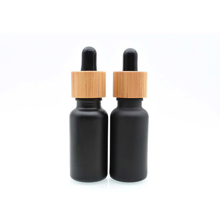 Hot sale 5ml 10ml 15ml 20ml 30ml 50ml 100ml bamboo cap lid essential oil matte black frosted glass bamboo dropper bottle