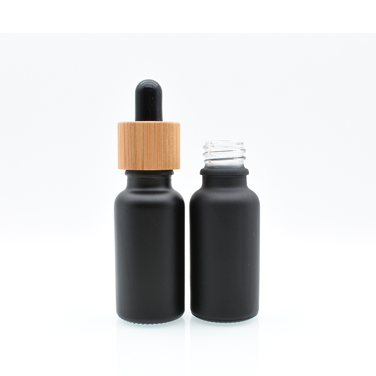 Hot sale 5ml 10ml 15ml 20ml 30ml 50ml 100ml bamboo cap lid essential oil matte black frosted glass bamboo dropper bottle