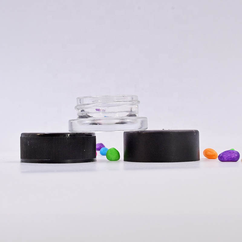 Hot sale 9 ml clear round small straight side eye cream cosmetic packing glass jar with black plastic child proof lid.