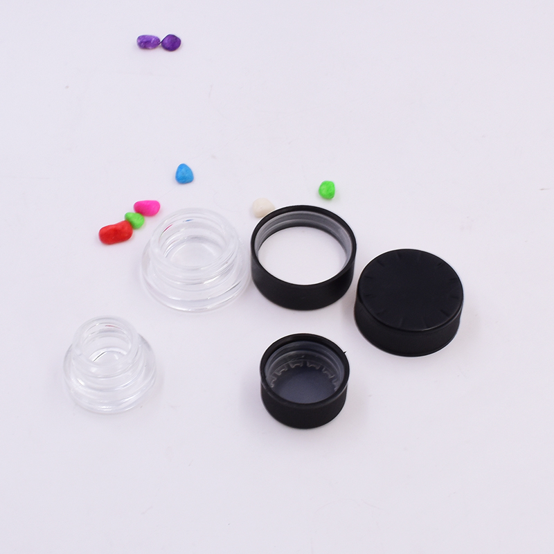 Hot sale 9 ml clear round small straight side eye cream cosmetic packing glass jar with black plastic child proof lid.