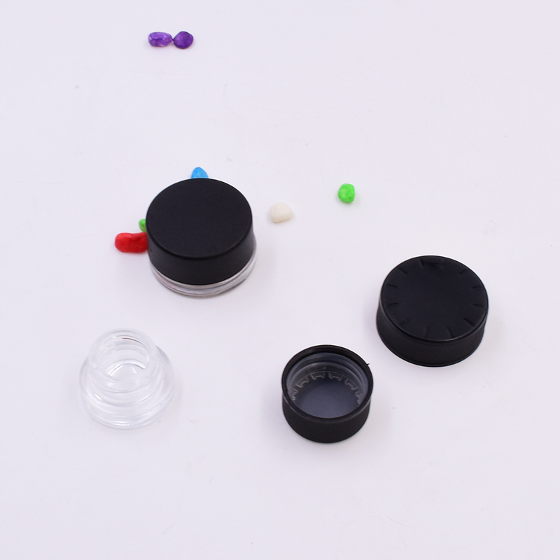 Hot sale 9 ml clear round small straight side eye cream cosmetic packing glass jar with black plastic child proof lid.