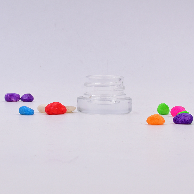 Hot sale 9 ml clear round small straight side eye cream cosmetic packing glass jar with black plastic child proof lid.