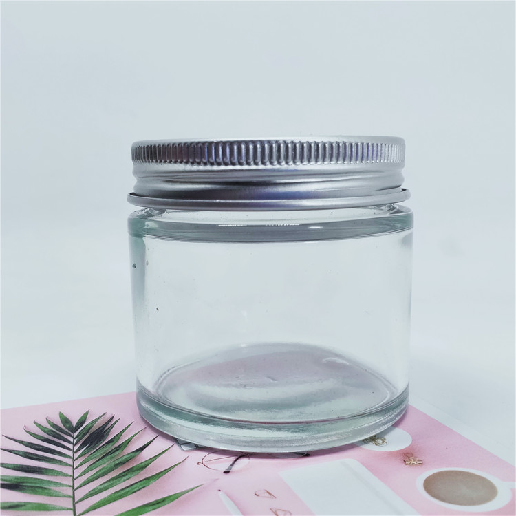 Hot sale Clear cosmetic glass jar 60g with aluminium lid