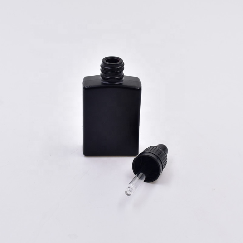 Hot sale OEM empty 30 ML square black frosting essential oil perfume cosmetic packing glass bottle with plastic black dropper