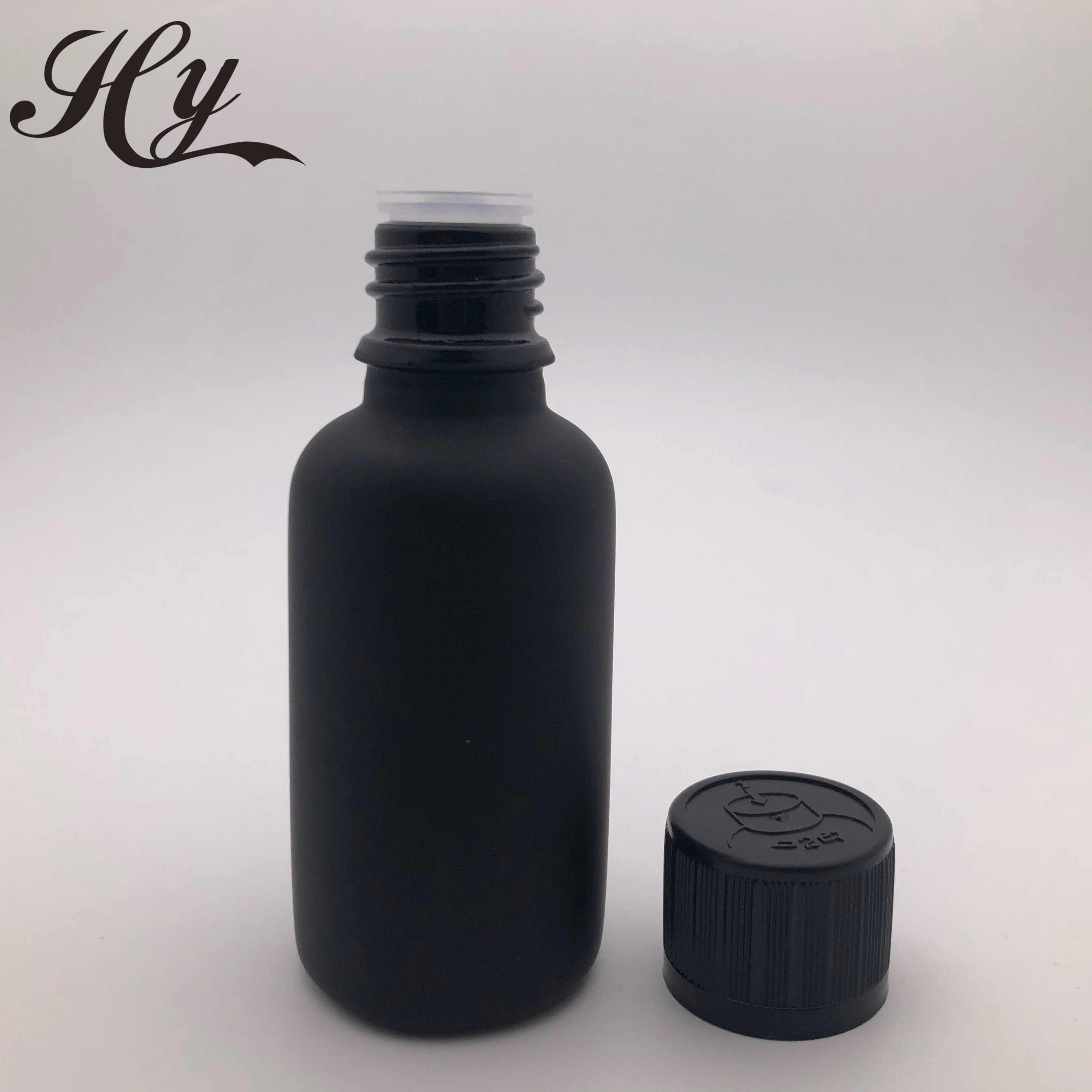 Hot sale black cosmetic essential oil glass bottle with screw cap