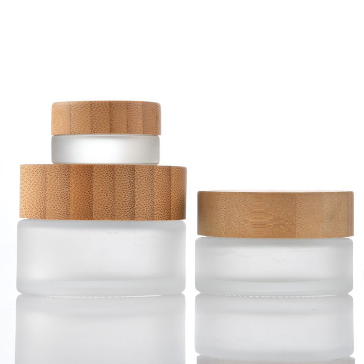 Hot sale cosmetic face cream container 5ml 15ml 30ml 50ml 100ml frosted clear glass jar with bamboo wood lid