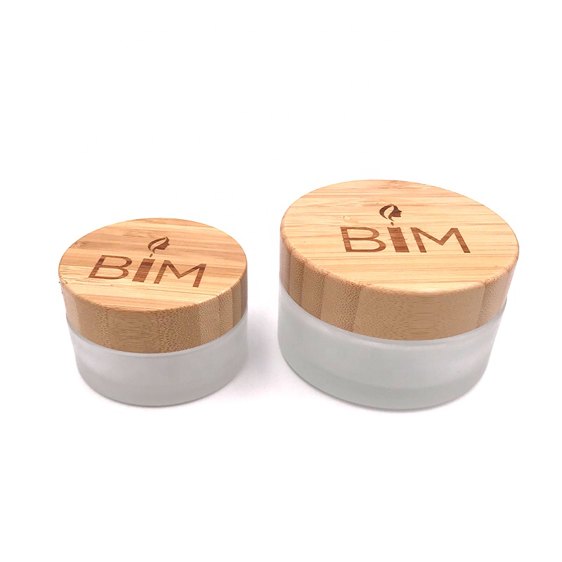 Hot sale cosmetic face cream container 5ml 15ml 30ml 50ml 100ml frosted clear glass jar with bamboo wood lid