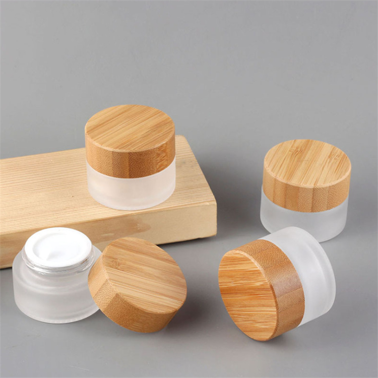 Hot sale cosmetic face cream container 5ml 15ml 30ml 50ml 100ml frosted clear glass jar with bamboo wood lid