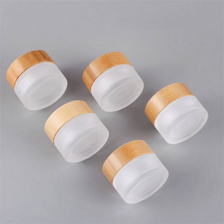 Hot sale cosmetic face cream container 5ml 15ml 30ml 50ml 100ml frosted clear glass jar with bamboo wood lid