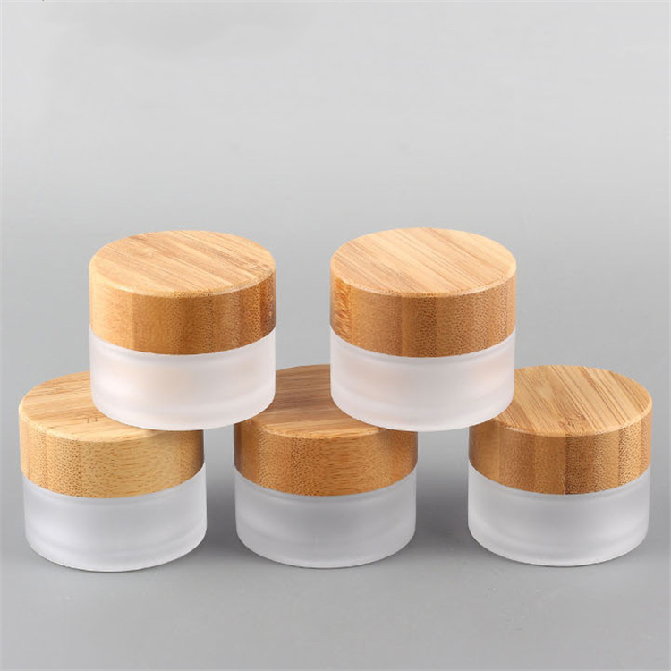 Hot sale cosmetic face cream container 5ml 15ml 30ml 50ml 100ml frosted clear glass jar with bamboo wood lid