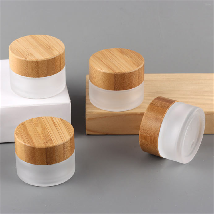 Hot sale cosmetic face cream container 5ml 15ml 30ml 50ml 100ml frosted clear glass jar with bamboo wood lid