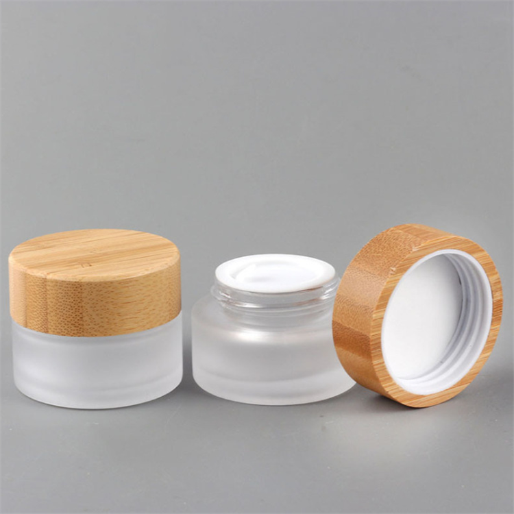 Hot sale cosmetic face cream container 5ml 15ml 30ml 50ml 100ml frosted clear glass jar with bamboo wood lid