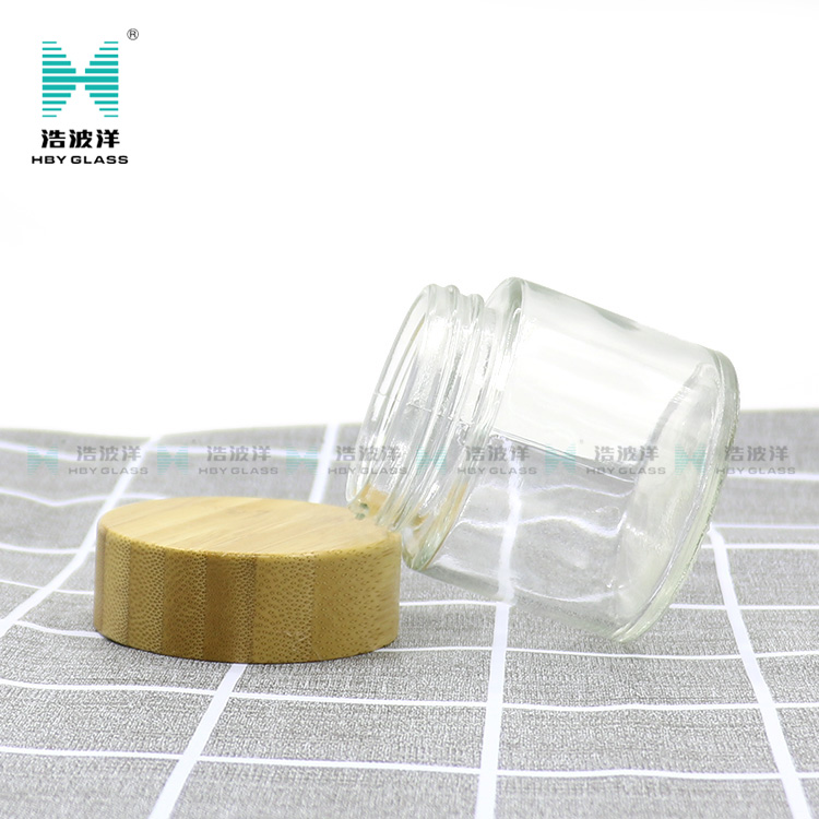 Hot sale cosmetic face cream container 90ml frosted clear glass jar with bamboo wood lid